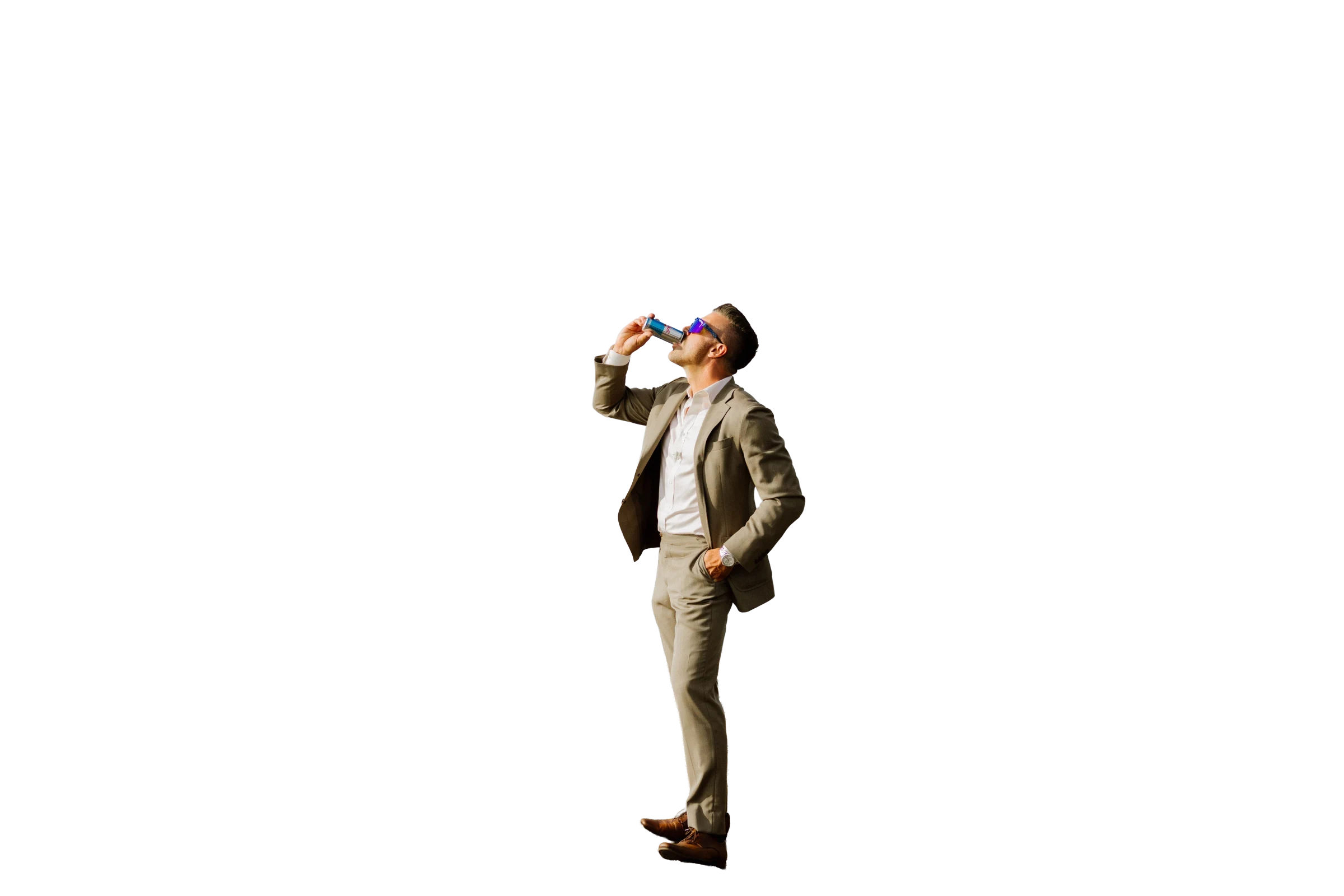 Jeff Maeck drinking a Red Bull on a coastal cliff
